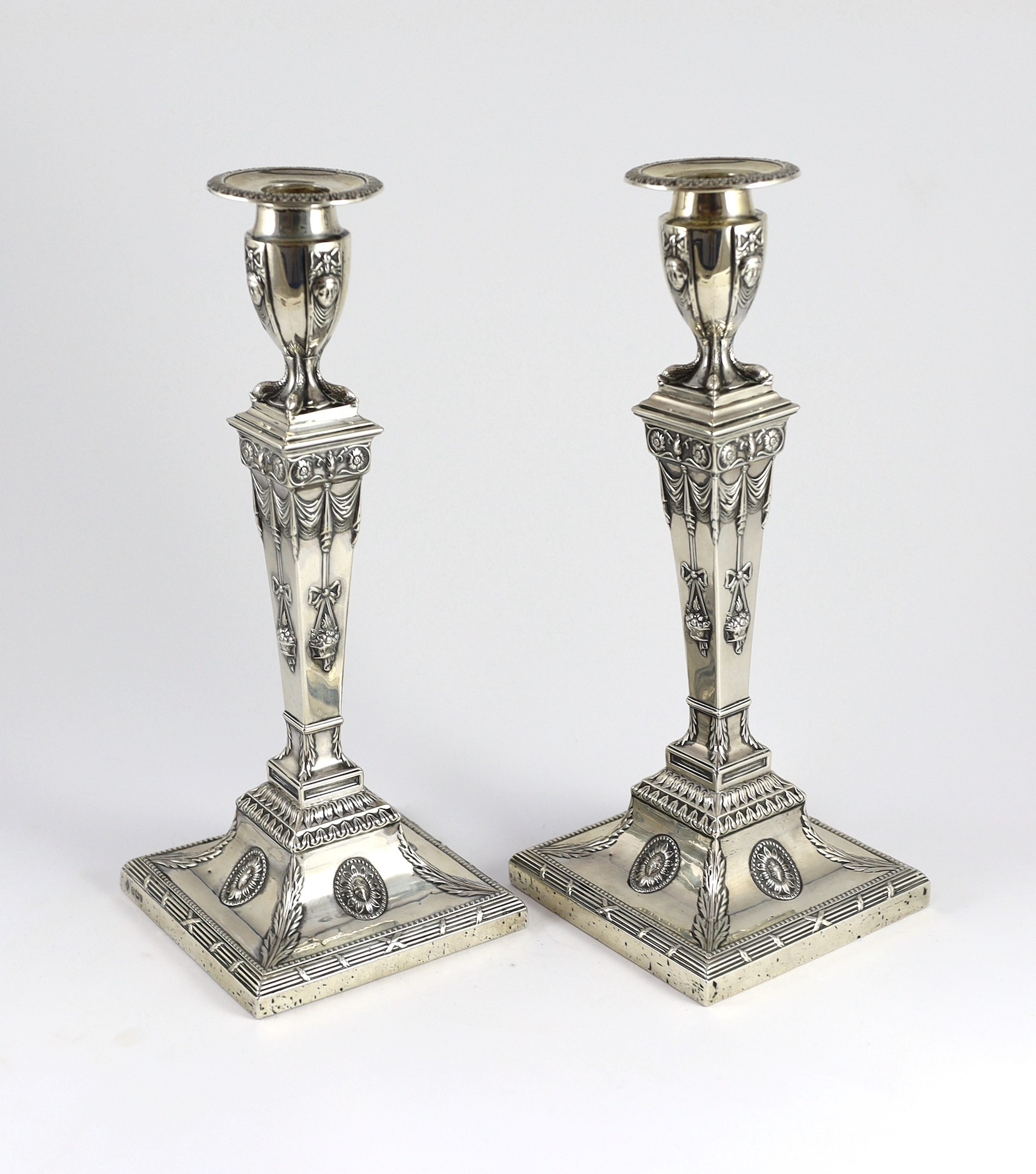 An ornate pair of late Victorian silver candlesticks by Mappin Bros.